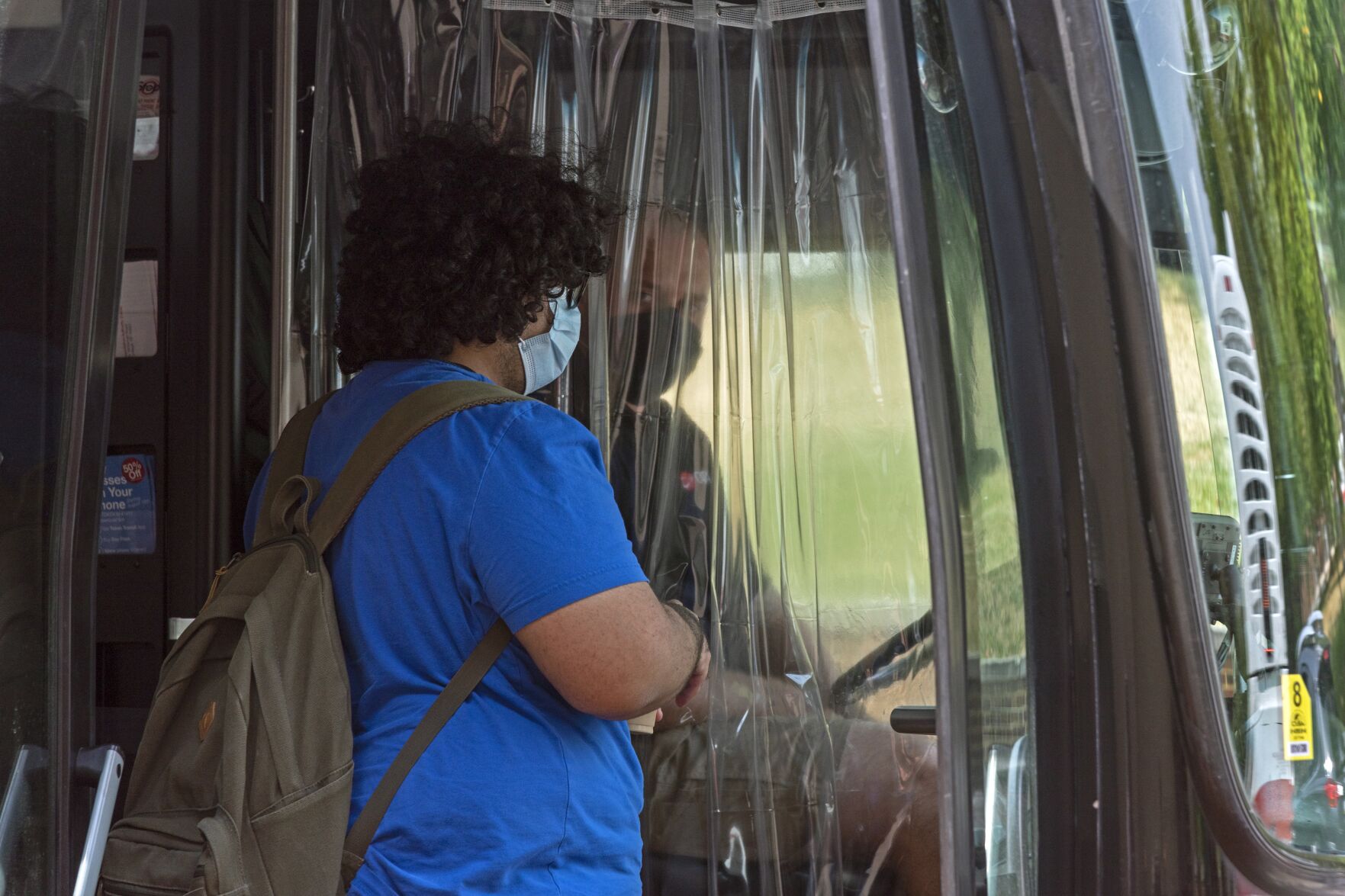 Student and CATA Bus Driver Through Plastic Divider